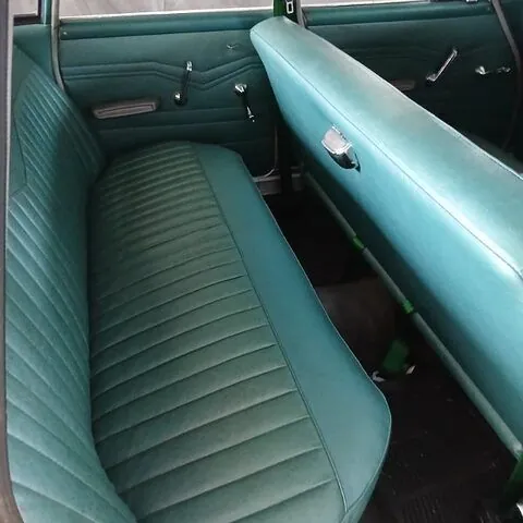 Blue-green vinyl rear bench seat and door trims in the 1962 Chrysler Valiant S Series