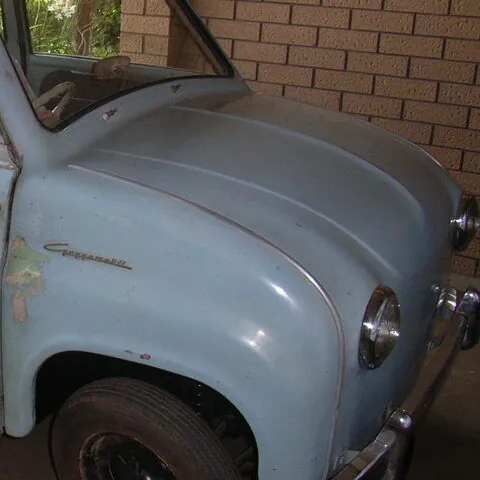 Bonnet, front guard, headlamp and Goggomobil script badge on the original blue paint of the c1958 Goggomobil T300 sedan