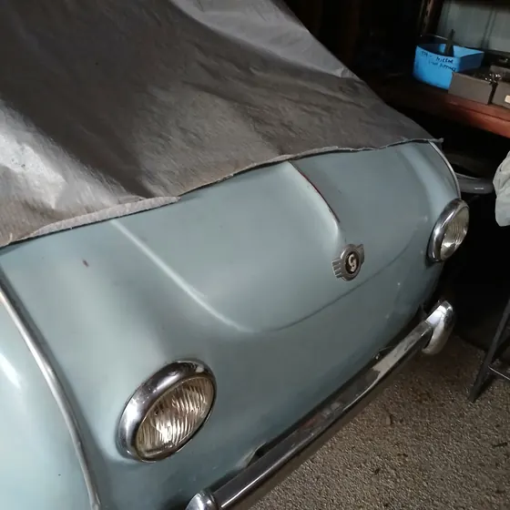 Front of the c1958 Goggomobil T300 sedan showing the original light blue paint, headlamps, badge and bumper