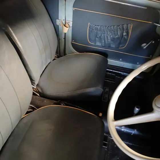 Original front seats, door card with map pocket and steering wheel inside the c1958 Goggomobil T300 sedan