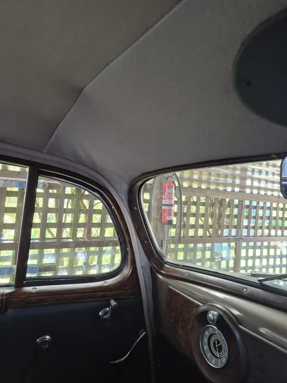 Woodgrain window garnish, rear door trims and headlining inside the 1936 Oldsmobile F-37 sedan